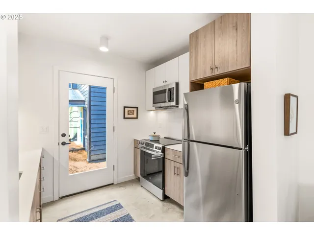 a kitchen with sink and cabinets