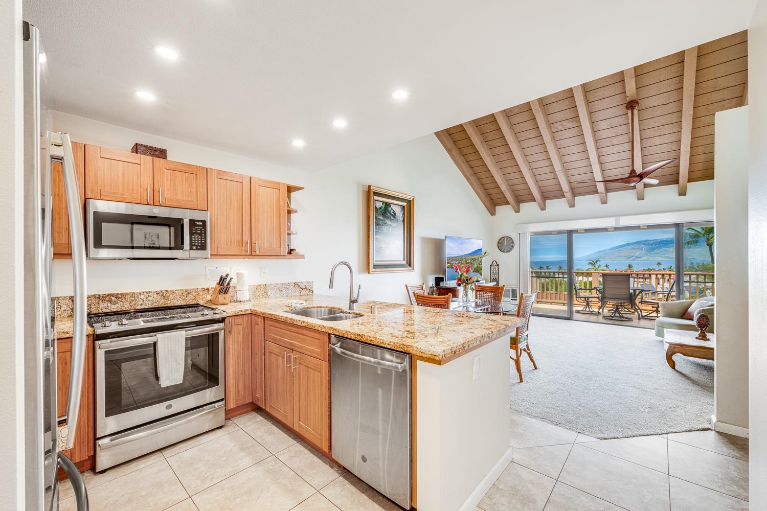 2777 South Kihei Road, Unit J214 Kihei, HI 96753 - Photo 14 of 46 a kitchen with a sink stove and cabinets