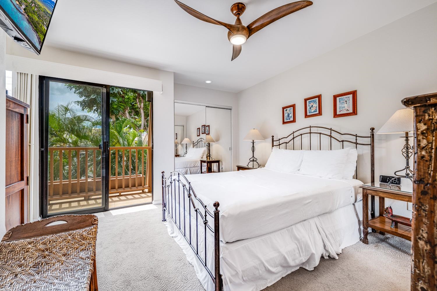 2777 South Kihei Road, Unit J214 Kihei, HI 96753 - Photo 20 of 46 a bedroom with a bed and a large window