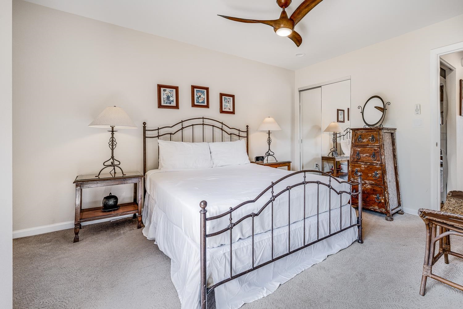 2777 South Kihei Road, Unit J214 Kihei, HI 96753 - Photo 23 of 46 a bedroom with a bed and a chandelier
