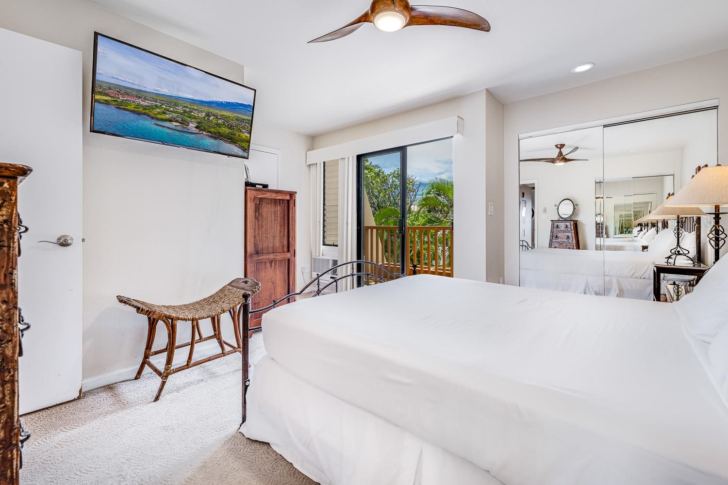2777 South Kihei Road, Unit J214 Kihei, HI 96753 - Photo 24 of 46 a bedroom with furniture and a large window