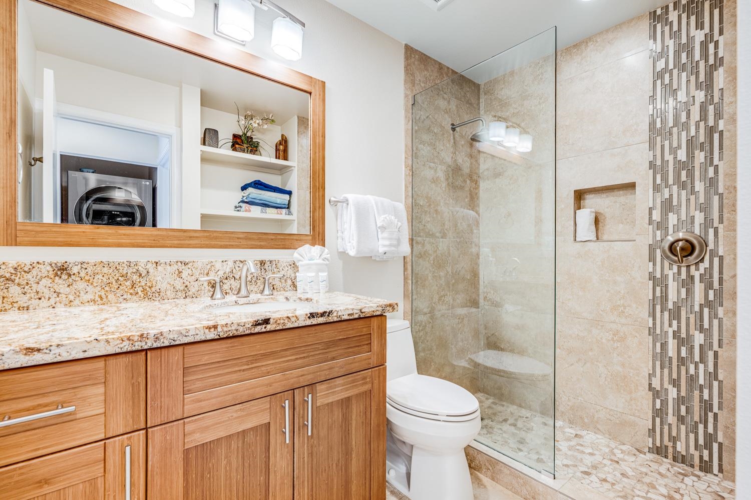 2777 South Kihei Road, Unit J214 Kihei, HI 96753 - Photo 25 of 46 a bathroom with a granite countertop sink a toilet and shower
