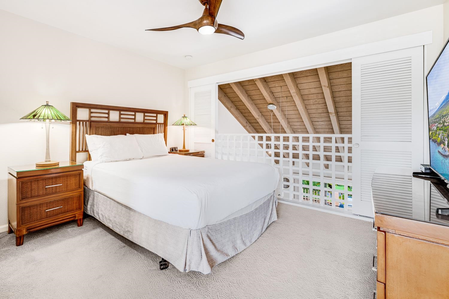 2777 South Kihei Road, Unit J214 Kihei, HI 96753 - Photo 29 of 46 a bed room with a bed and a chair