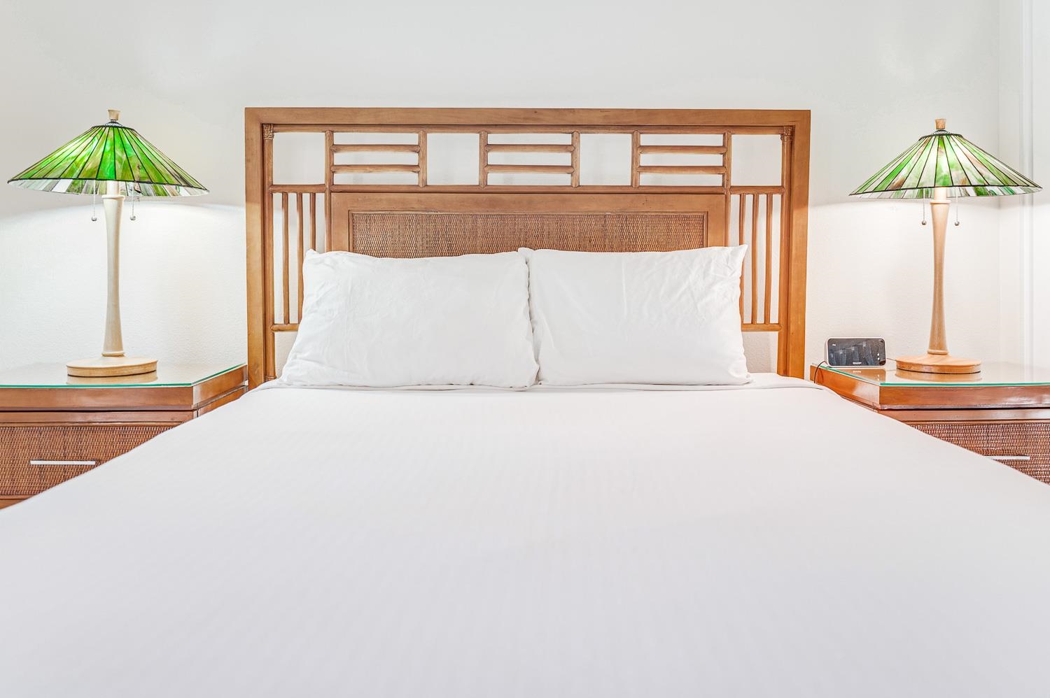2777 South Kihei Road, Unit J214 Kihei, HI 96753 - Photo 31 of 46 a bedroom with a bed and a table