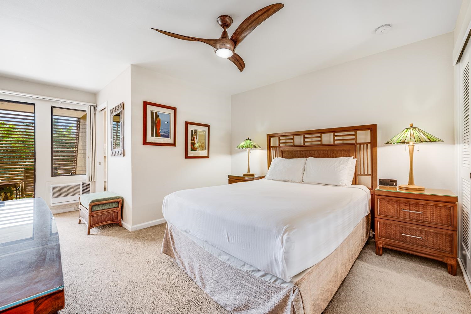 2777 South Kihei Road, Unit J214 Kihei, HI 96753 - Photo 32 of 46 a bedroom with a bed a couch and a window