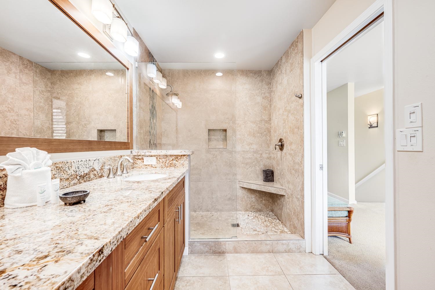 2777 South Kihei Road, Unit J214 Kihei, HI 96753 - Photo 34 of 46 a bathroom with a granite countertop sink a toilet and shower