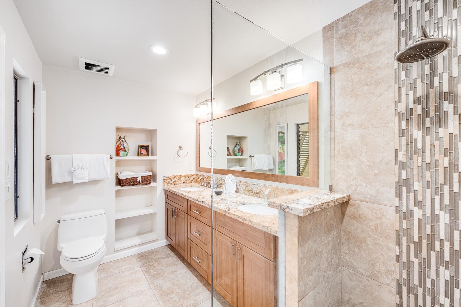 2777 South Kihei Road, Unit J214 Kihei, HI 96753 - Photo 35 of 46 a bathroom with a granite countertop sink mirror vanity and toilet