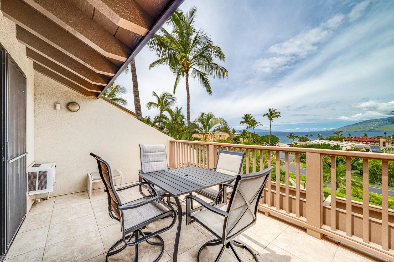 2777 South Kihei Road, Unit J214 Kihei, HI 96753 - Photo 9 of 46 a view of a chairs and table on the terrace