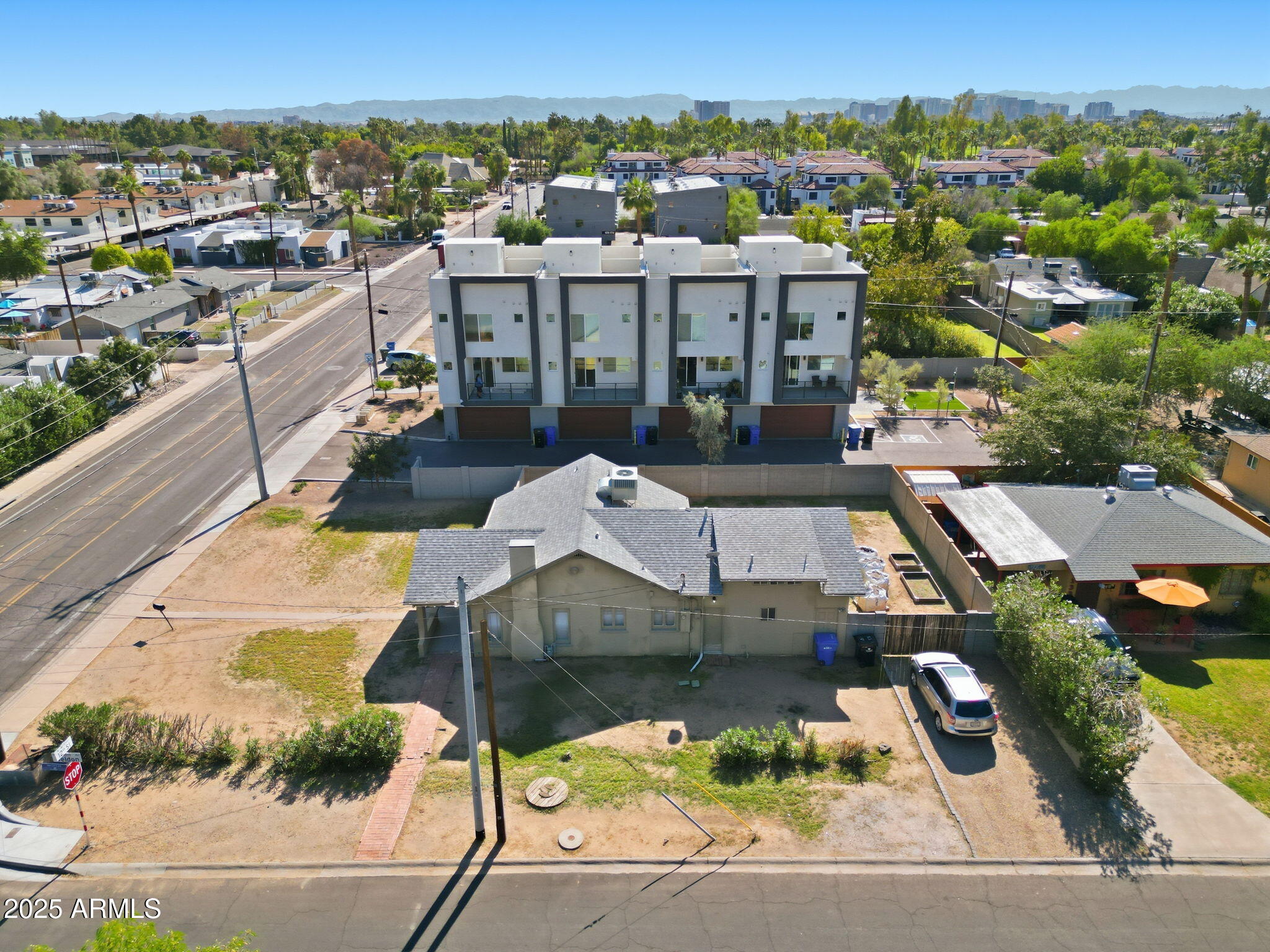 an aerial view of a house with a yard