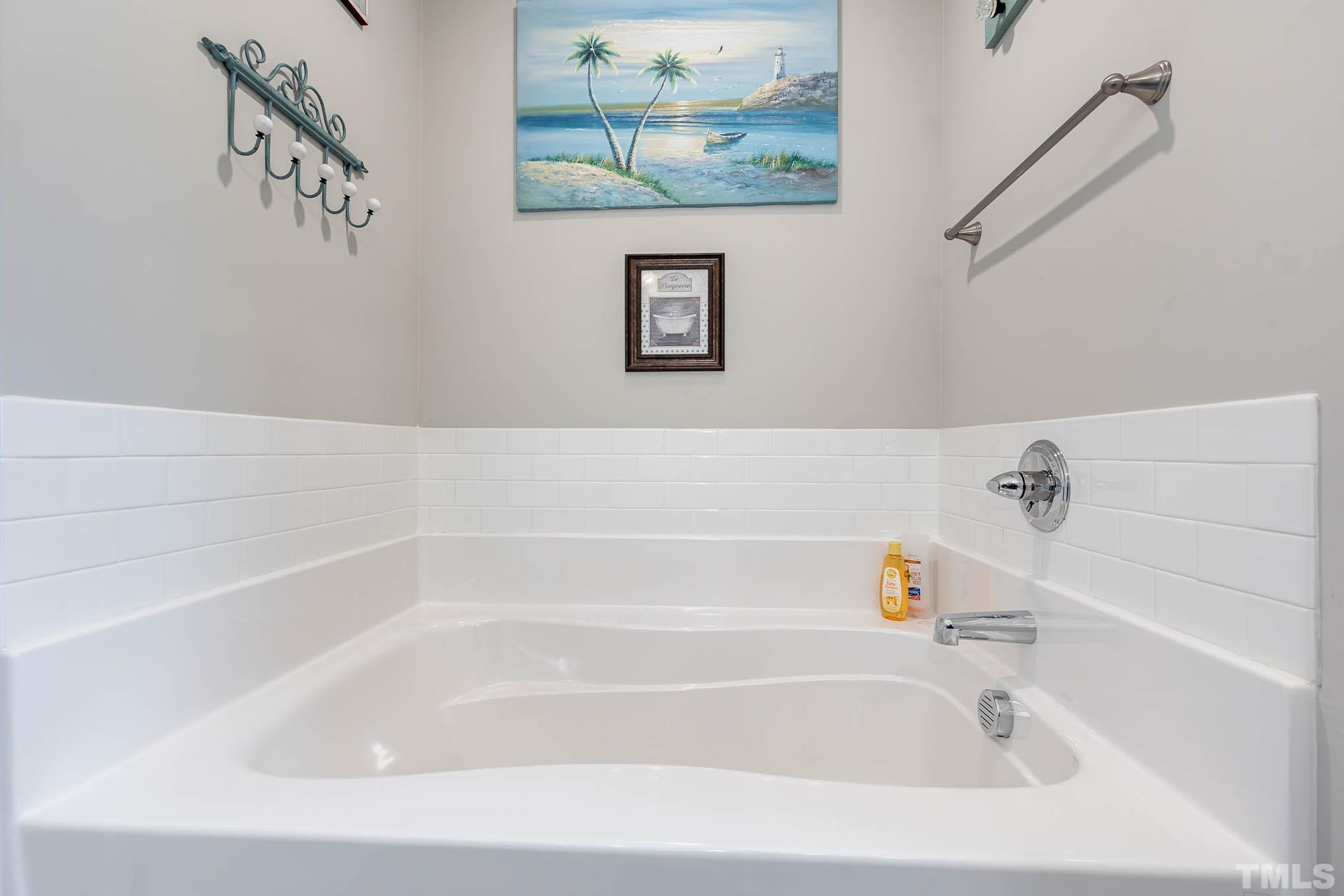 6551 Faircloth Bridge Road Stedman, NC 28391 - Photo 18 of 30 a bathroom with a bathtub