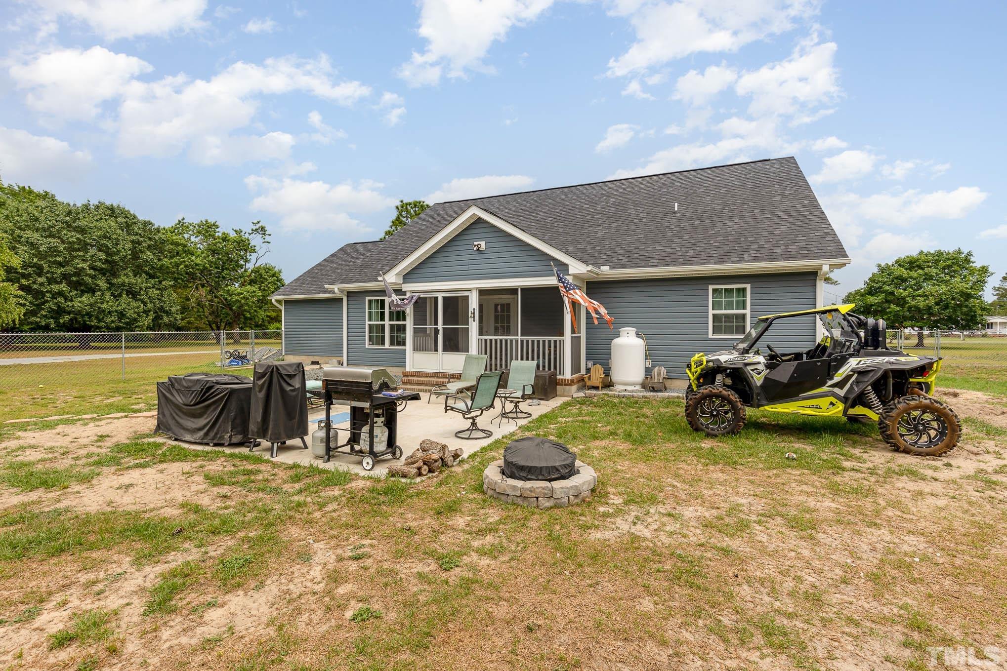 6551 Faircloth Bridge Road Stedman, NC 28391 - Photo 26 of 30 a view of a house with swimming pool and sitting area
