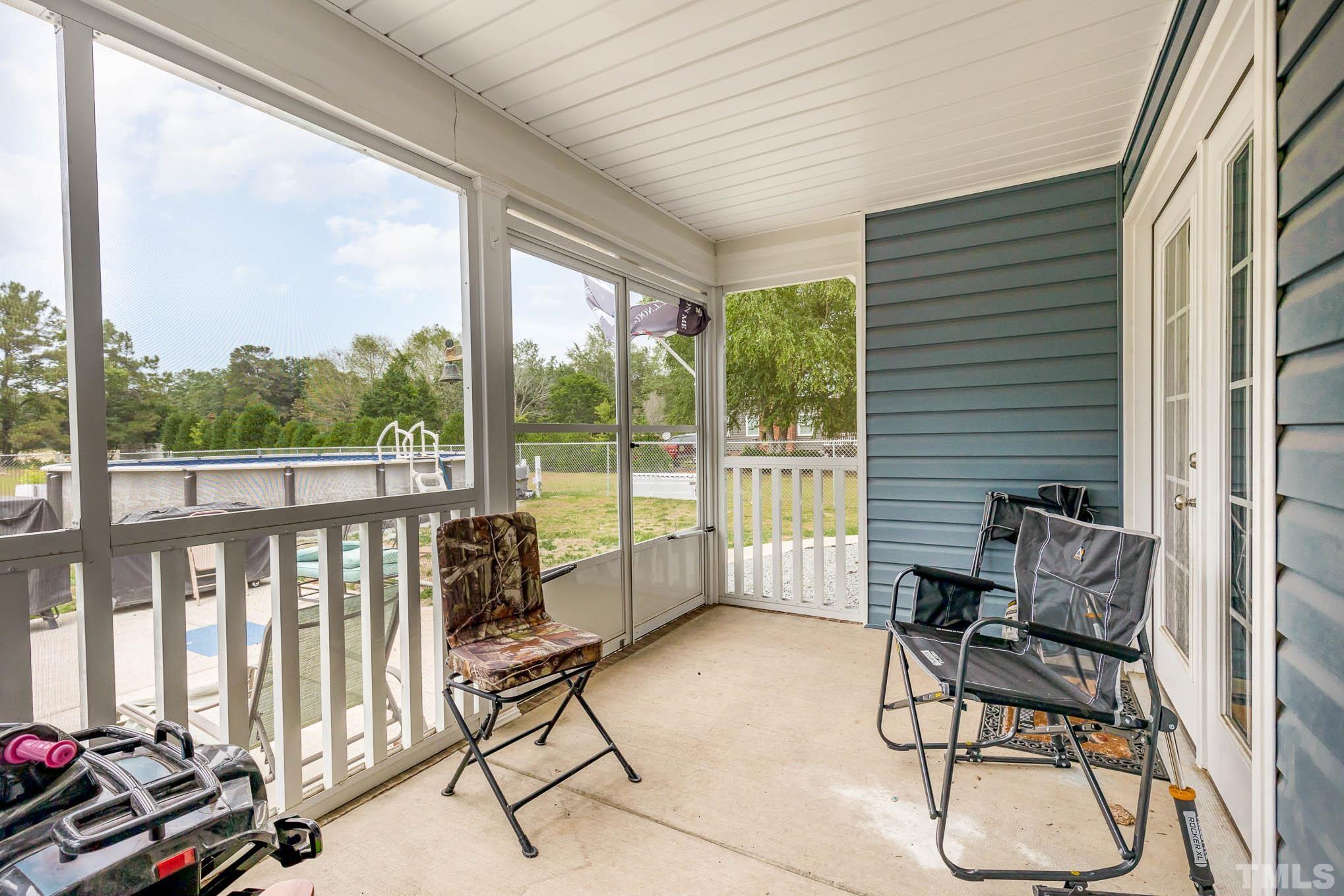 6551 Faircloth Bridge Road Stedman, NC 28391 - Photo 4 of 30 a building outdoor space with patio furniture