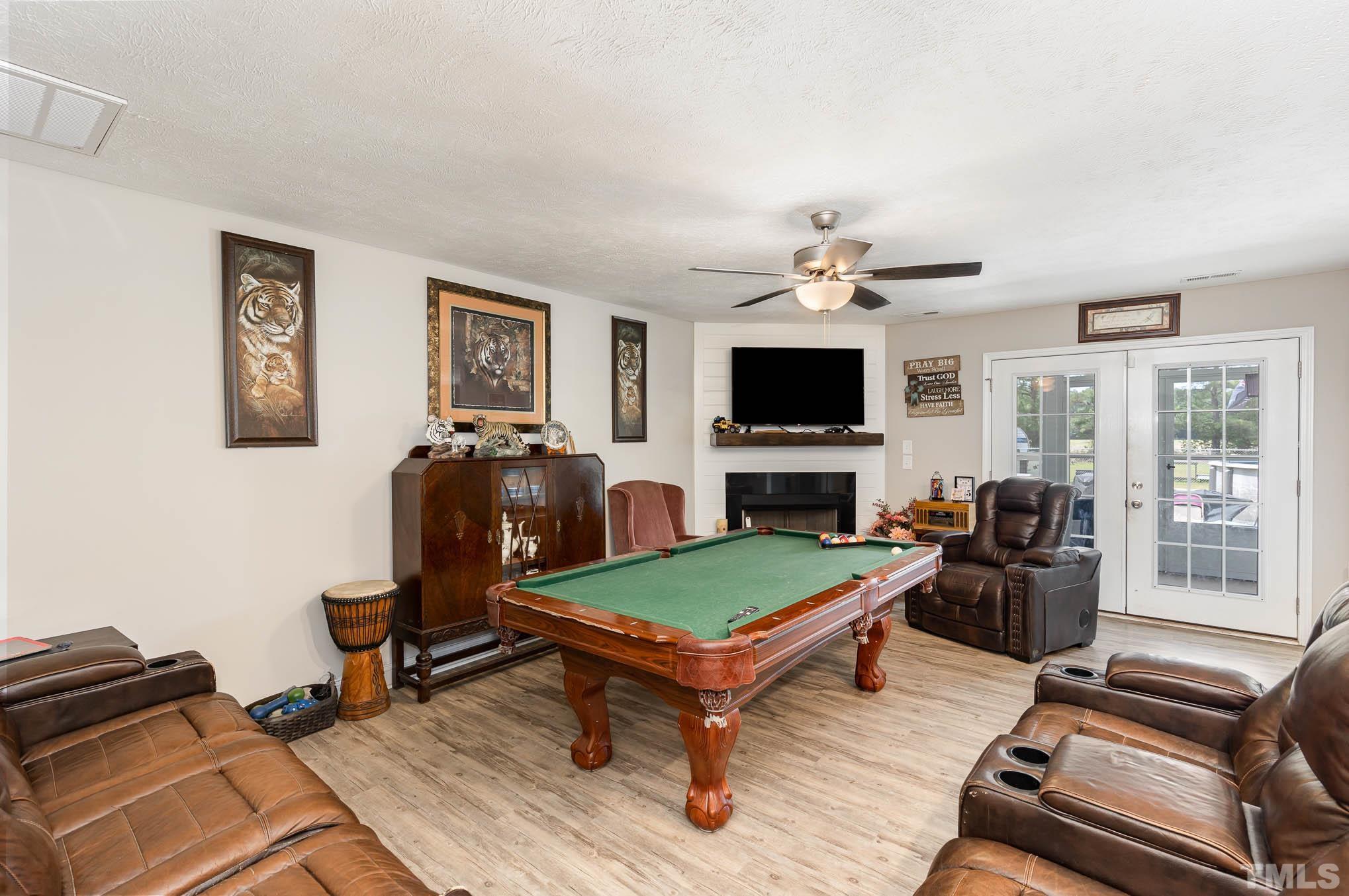 6551 Faircloth Bridge Road Stedman, NC 28391 - Photo 7 of 30 a living room with furniture and a flat screen tv