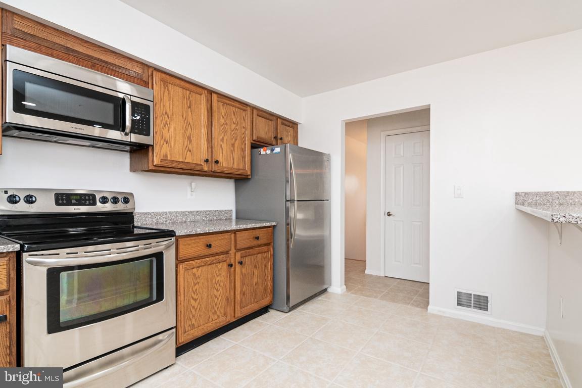 KITCHEN WITH DOOR TO HALL