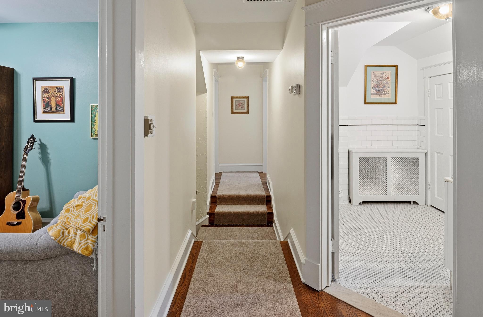 5952 Old Washington Road Elkridge, MD 21075 - Photo 19 of 43 a hallway with front door and couch