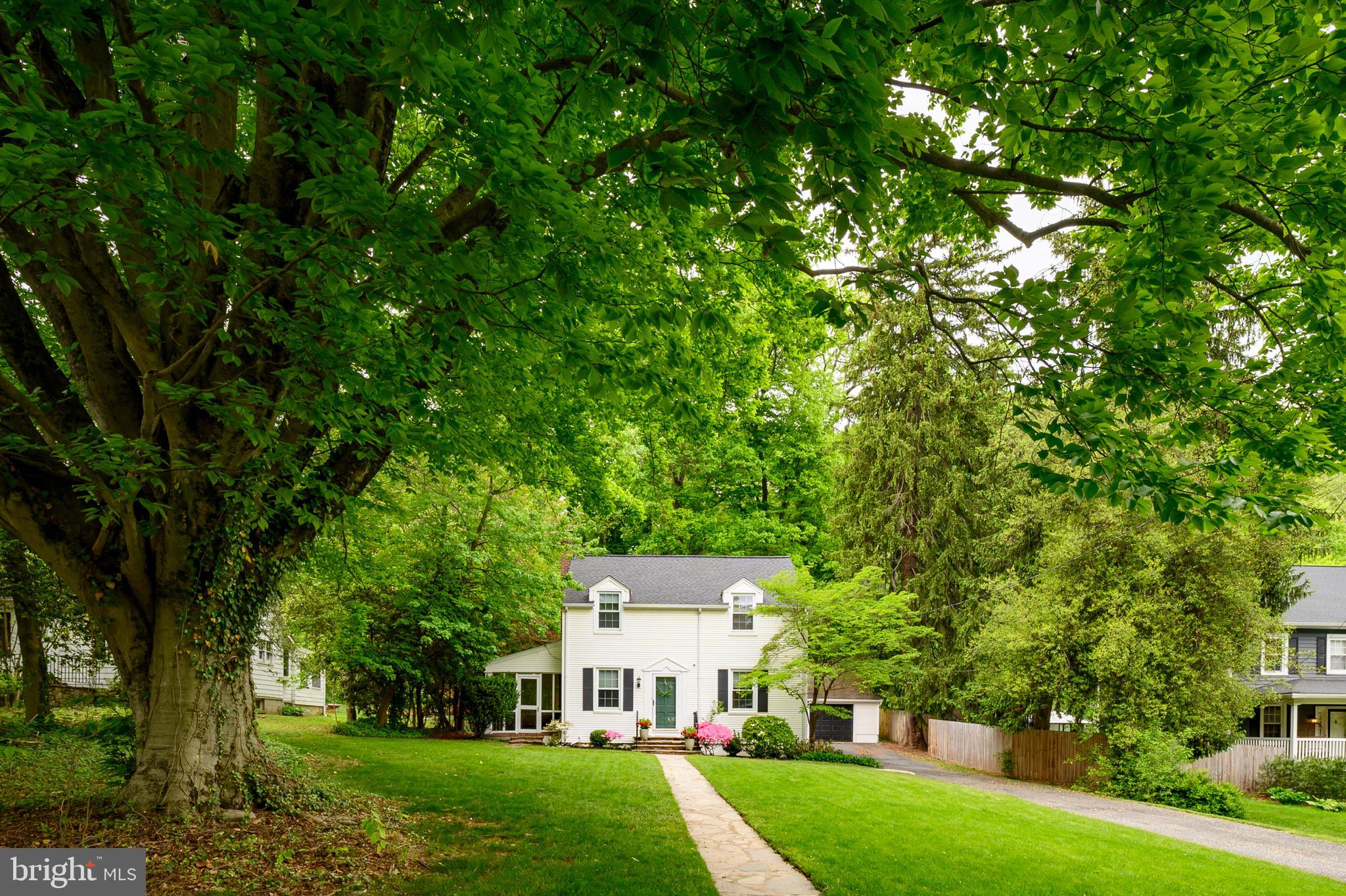 5952 Old Washington Road Elkridge, MD 21075 - Photo 2 of 43 a view of a big house with a big yard and large trees