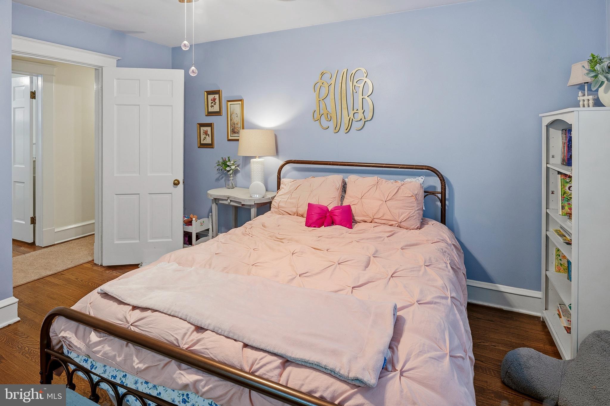 5952 Old Washington Road Elkridge, MD 21075 - Photo 28 of 43 a bedroom with a bed and a dresser
