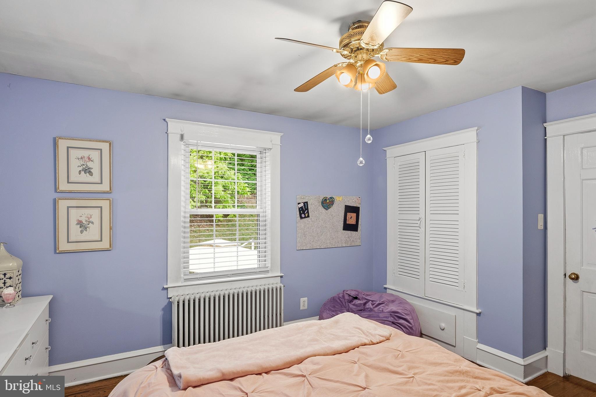 5952 Old Washington Road Elkridge, MD 21075 - Photo 29 of 43 a bedroom with a bed and a chandelier