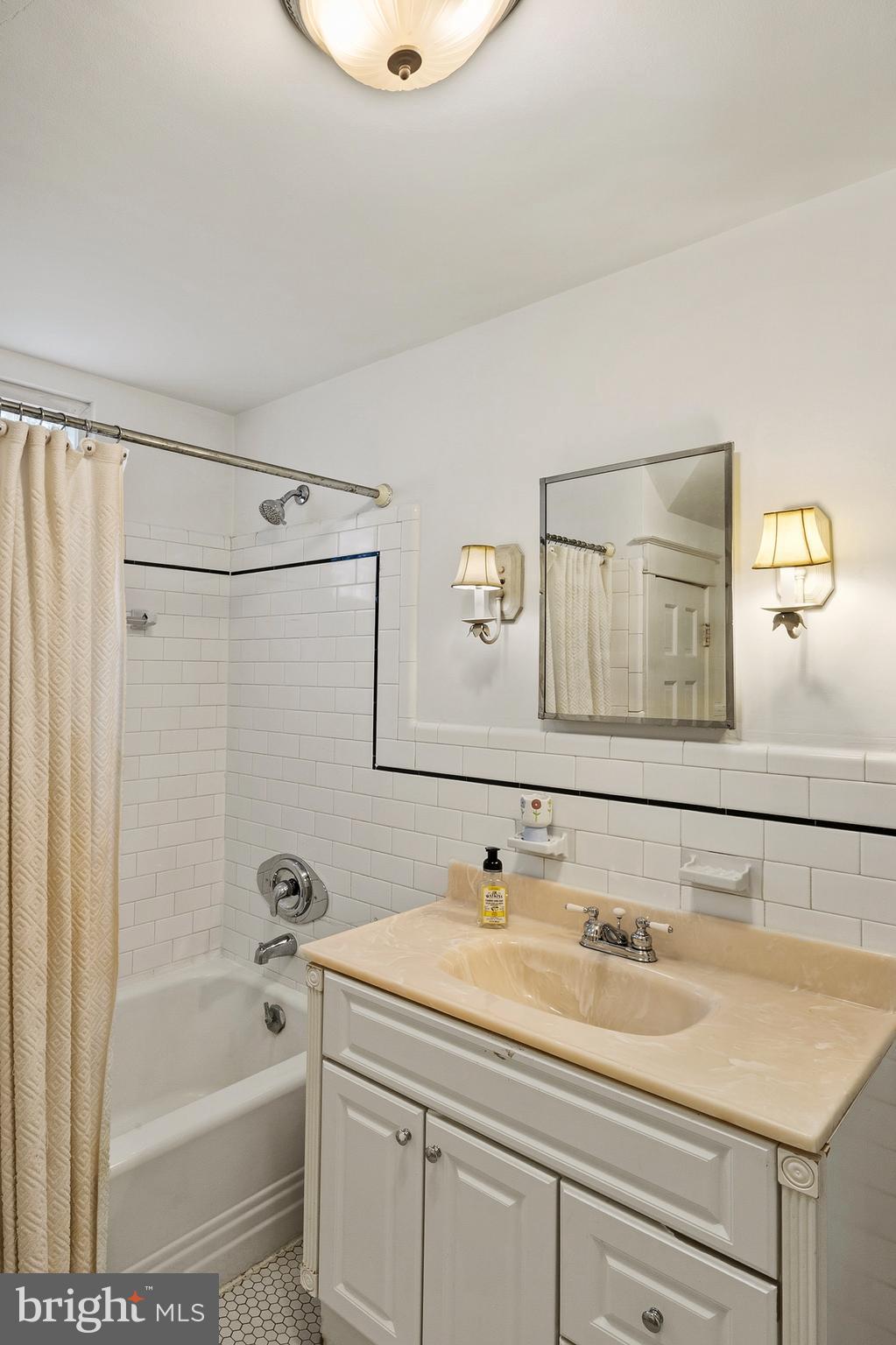 5952 Old Washington Road Elkridge, MD 21075 - Photo 32 of 43 a bathroom with a sink and a bathtub