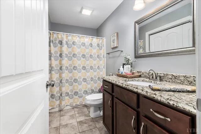 a bedroom with furniture and a flat screen tv