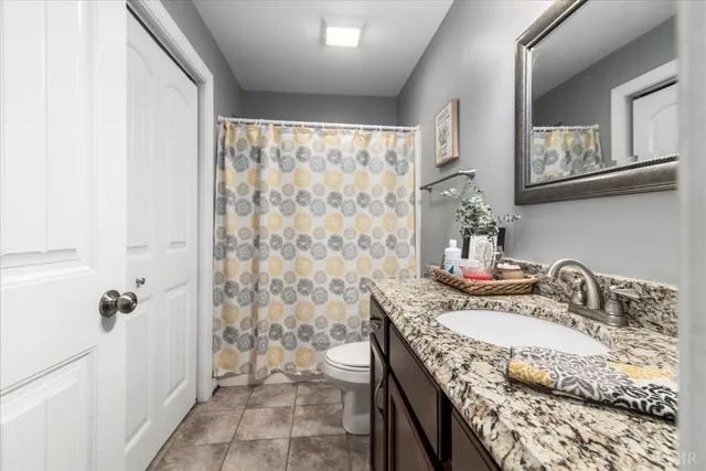 a view of a hallway to rooms