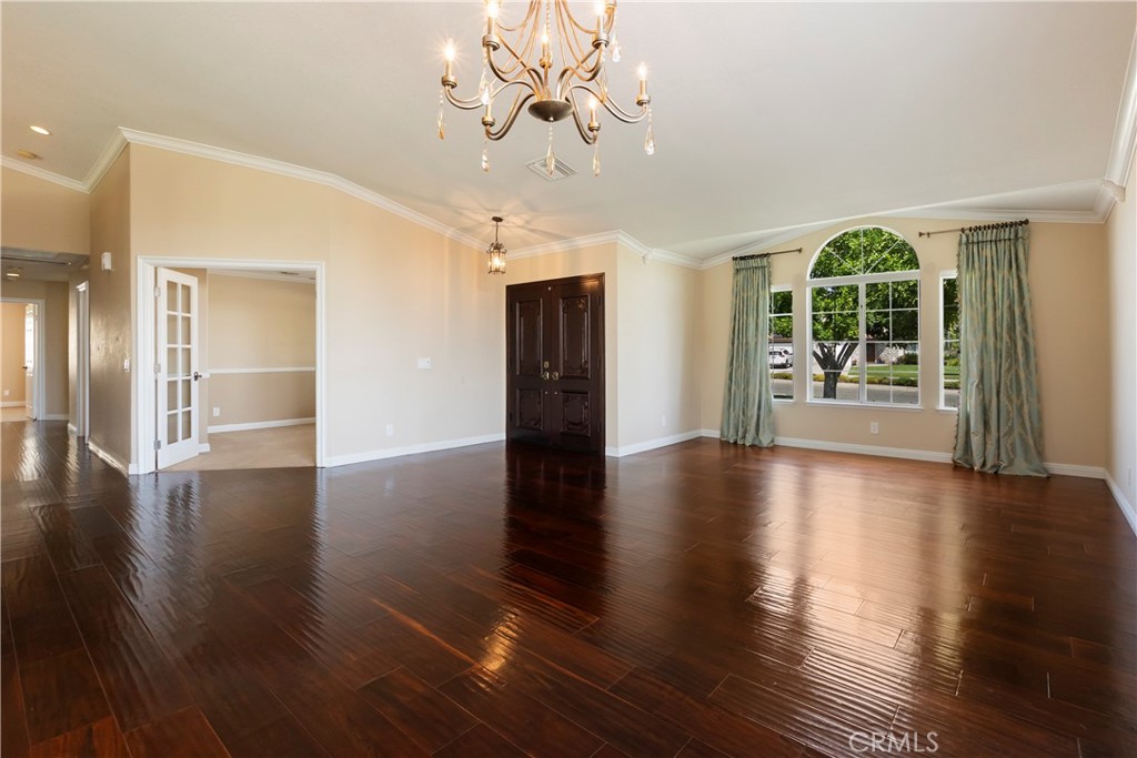 6717 Mission Grove Parkway North Riverside, CA 92506 - Photo 12 of 58 a view of an empty room with wooden floor and a window
