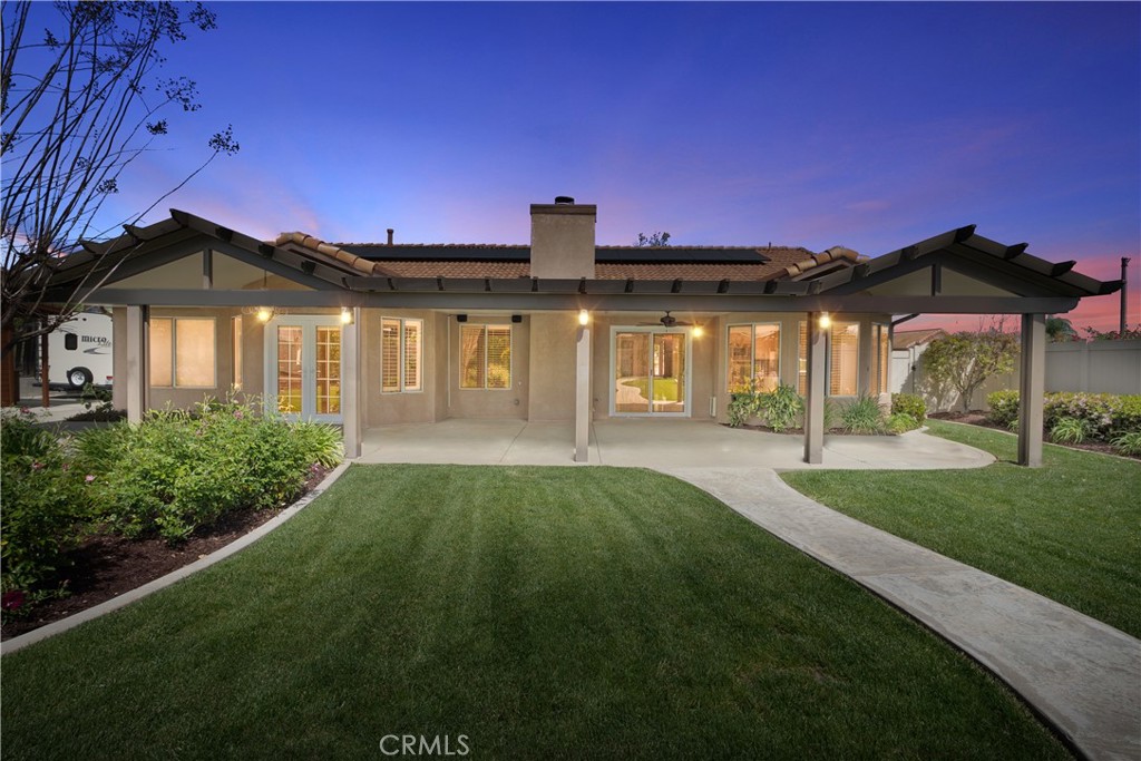6717 Mission Grove Parkway North Riverside, CA 92506 - Photo 2 of 58 a front view of a house with a garden