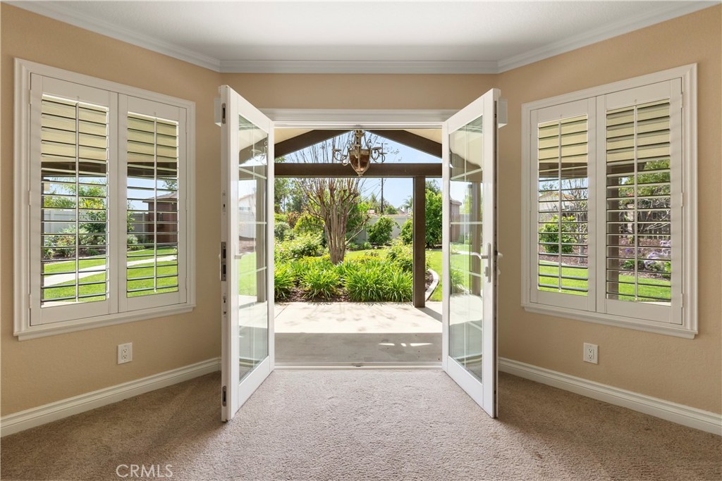 6717 Mission Grove Parkway North Riverside, CA 92506 - Photo 26 of 58 a view of front door and porch with a floor to ceiling window