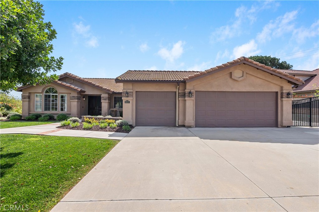 6717 Mission Grove Parkway North Riverside, CA 92506 - Photo 3 of 58 front view of a house with a yard