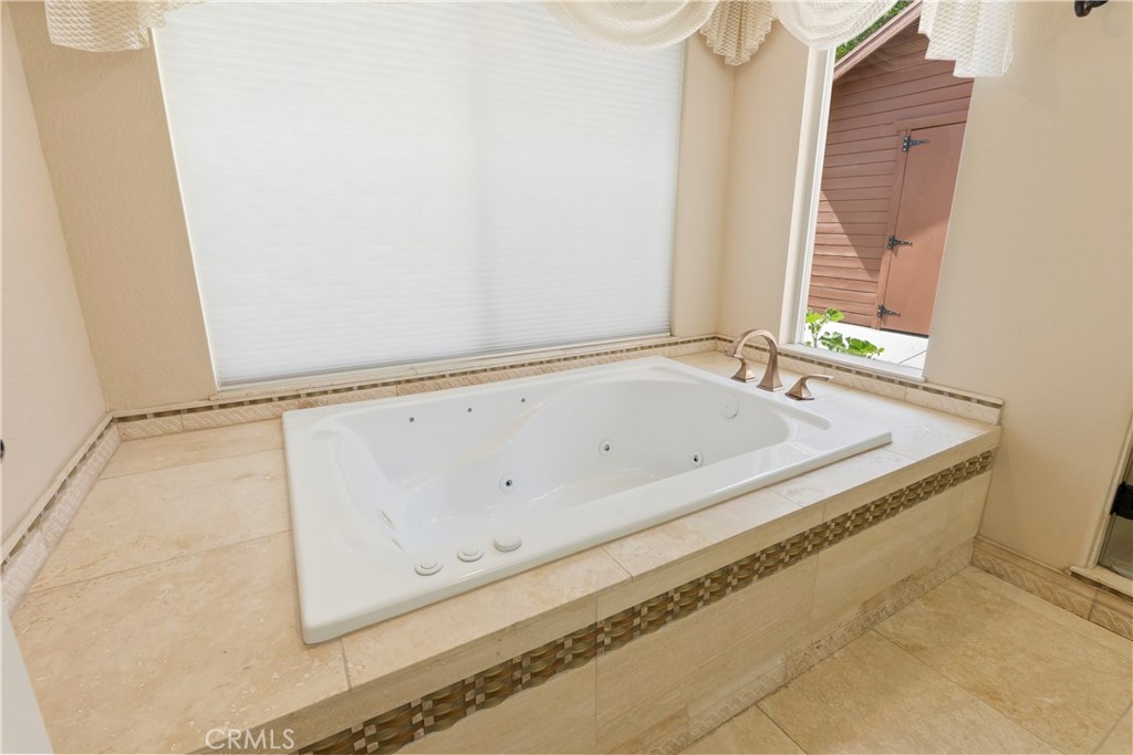6717 Mission Grove Parkway North Riverside, CA 92506 - Photo 32 of 58 a bath tub sitting next to a window