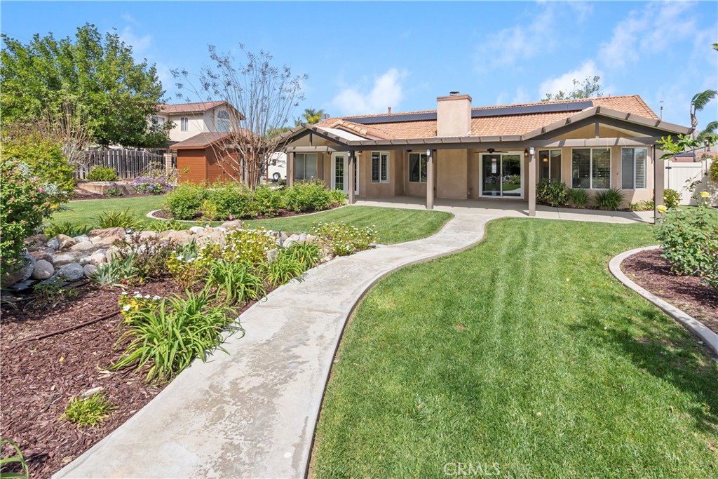 6717 Mission Grove Parkway North Riverside, CA 92506 - Photo 45 of 58 a front view of a house with a yard