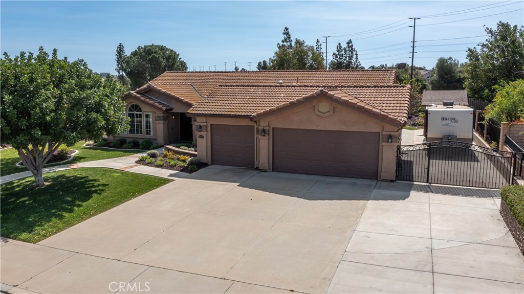 6717 Mission Grove Parkway North Riverside, CA 92506 - Photo 48 of 58 a front view of a house with a yard and garage