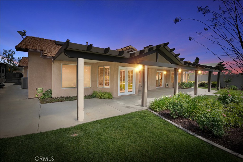 6717 Mission Grove Parkway North Riverside, CA 92506 - Photo 57 of 58 a view of a house with a small yard and floor to ceiling window
