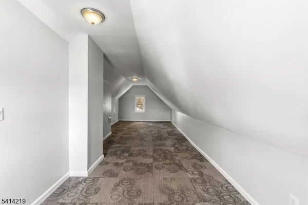 a view of a big room with closet and windows