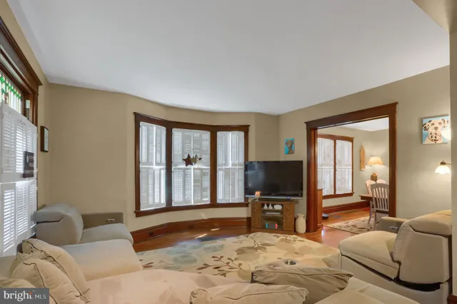 a bedroom with furniture and a flat screen tv