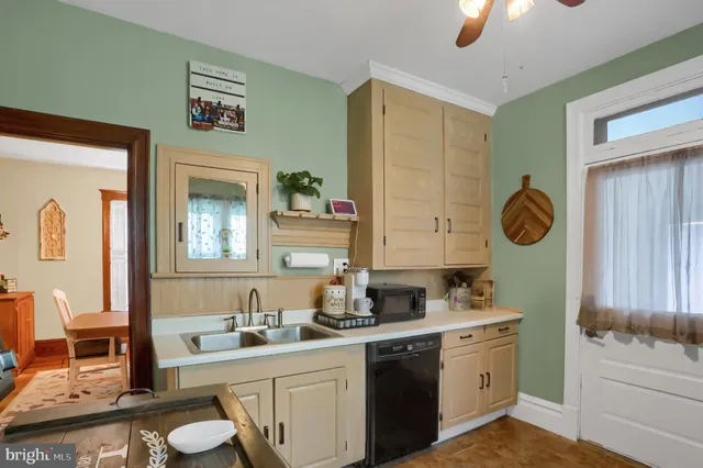 a kitchen with stainless steel appliances granite countertop a sink and cabinets