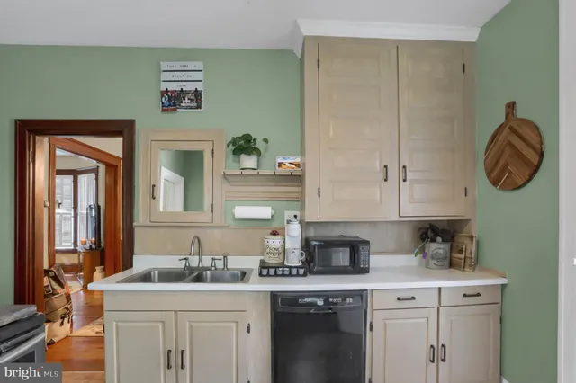a kitchen with stainless steel appliances granite countertop a sink and a cabinets