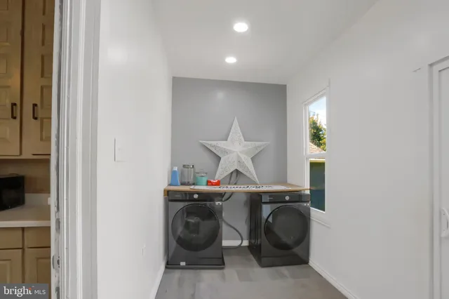 a utility room with dryer and washer