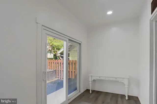 a view of room with window and entryway