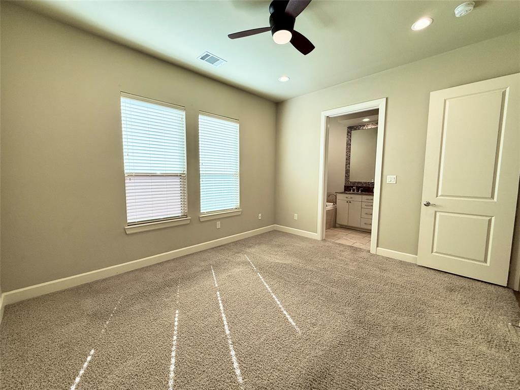 7333 Valley View Lane, Unit 101 Dallas, TX 75240 - Photo 5 of 7 a view of an empty room with a window