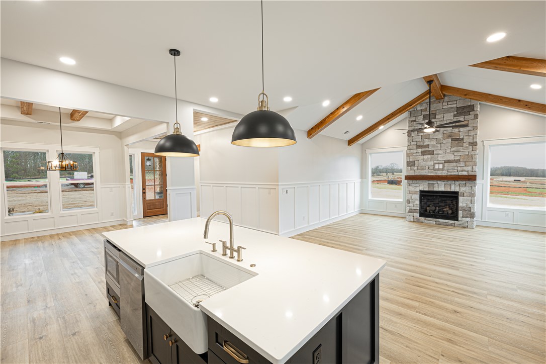 110 Hart Road Anderson, SC 29621 - Photo 14 of 31 This bright and airy interior features an open concept with vaulted ceilings and a statement fireplace.