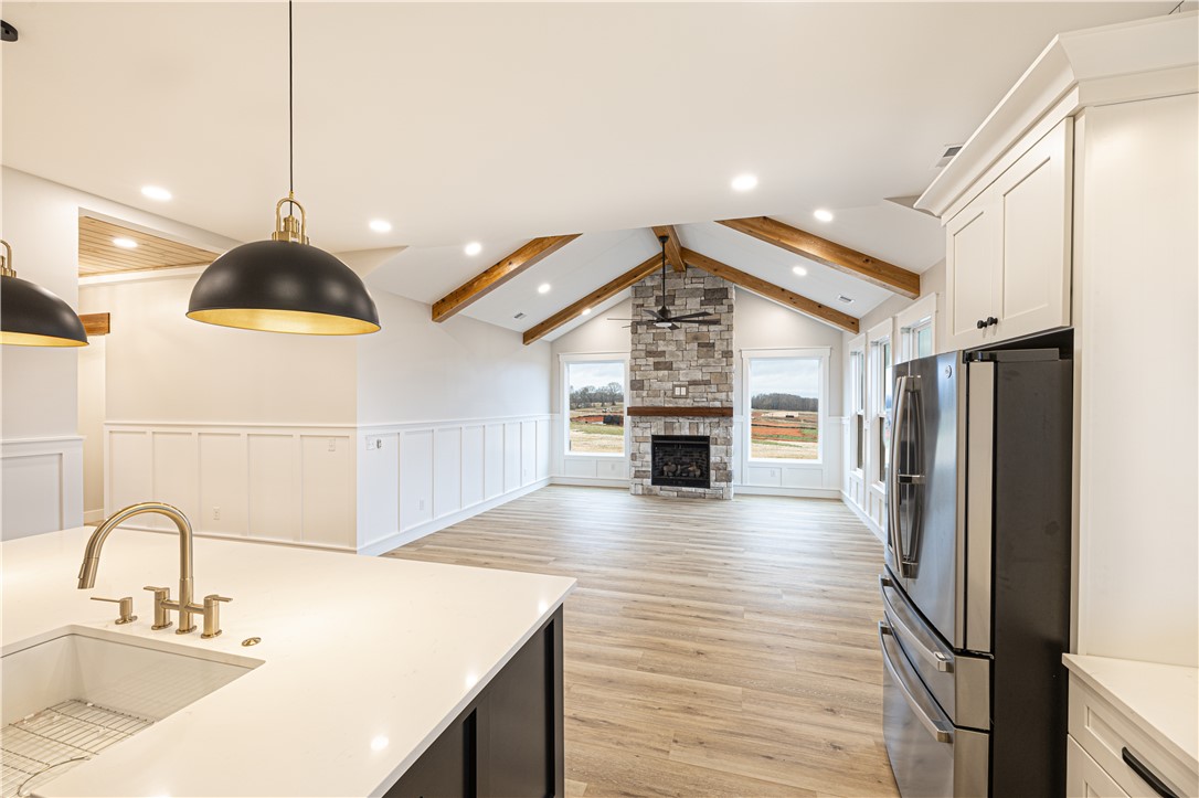 110 Hart Road Anderson, SC 29621 - Photo 16 of 31 This expansive great room and kitchen features an inviting fireplace and luminous hardwood flooring.
