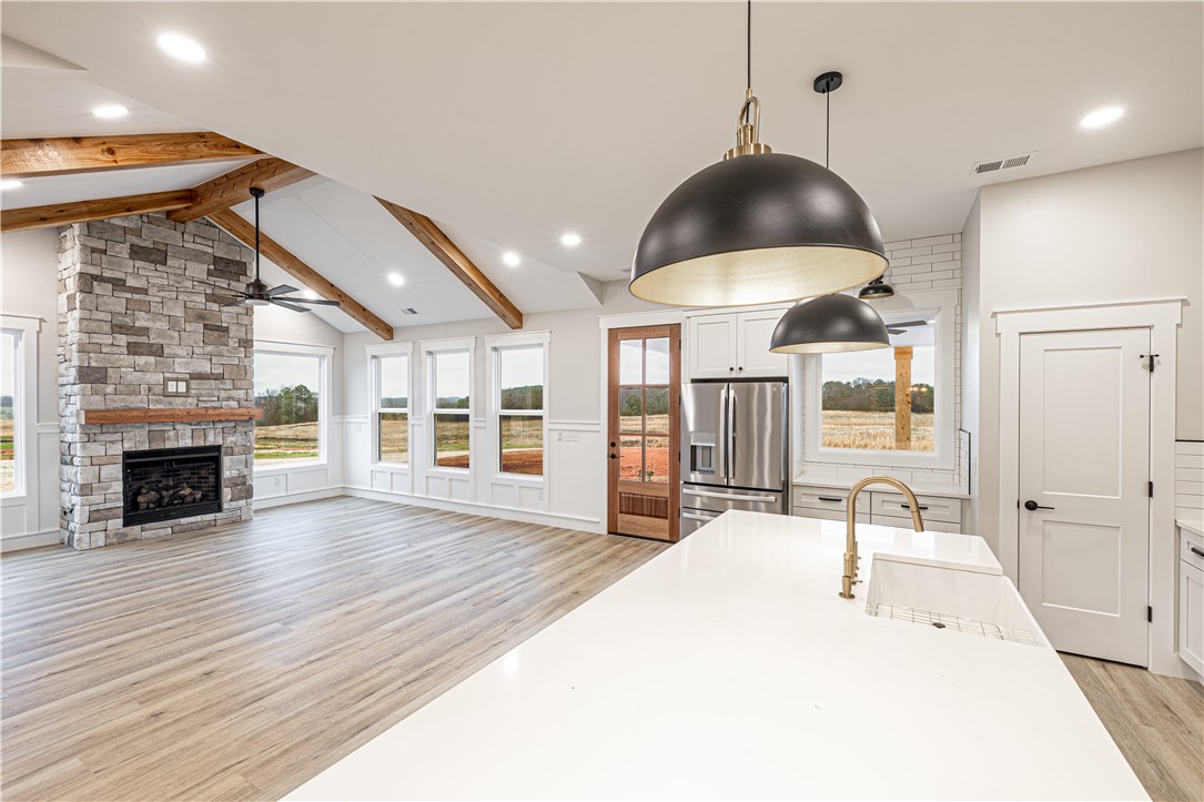110 Hart Road Anderson, SC 29621 - Photo 21 of 31 This airy open-concept living space features exposed beams and a kitchen with stainless steel appliances.