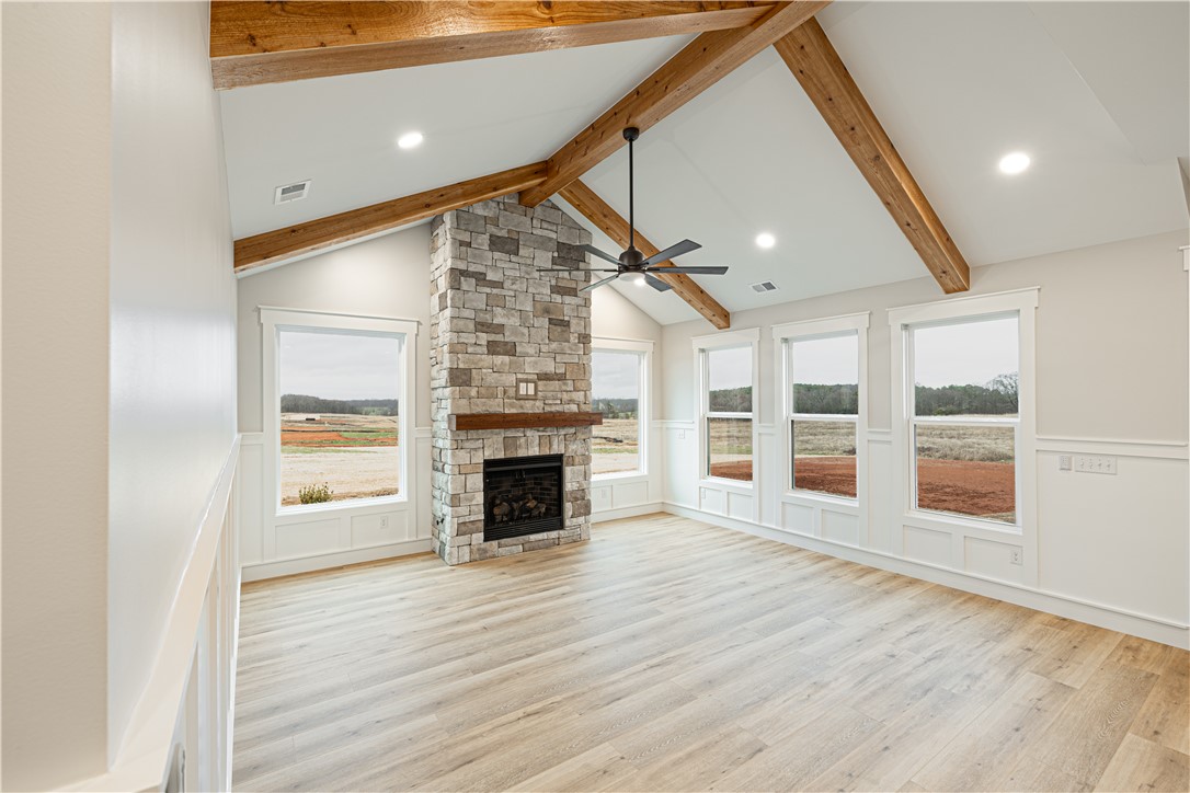 110 Hart Road Anderson, SC 29621 - Photo 22 of 31 This expansive living area features a grand stone fireplace, soaring vaulted ceilings, and abundant natural light.