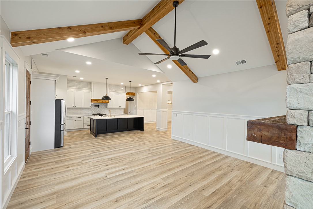 110 Hart Road Anderson, SC 29621 - Photo 29 of 31 This expansive open-concept interior features wood beams, a well-appointed kitchen, and durable flooring.