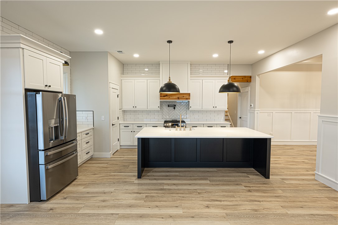 110 Hart Road Anderson, SC 29621 - Photo 30 of 31 This bright kitchen features an island, ample cabinetry, and sleek appliances.