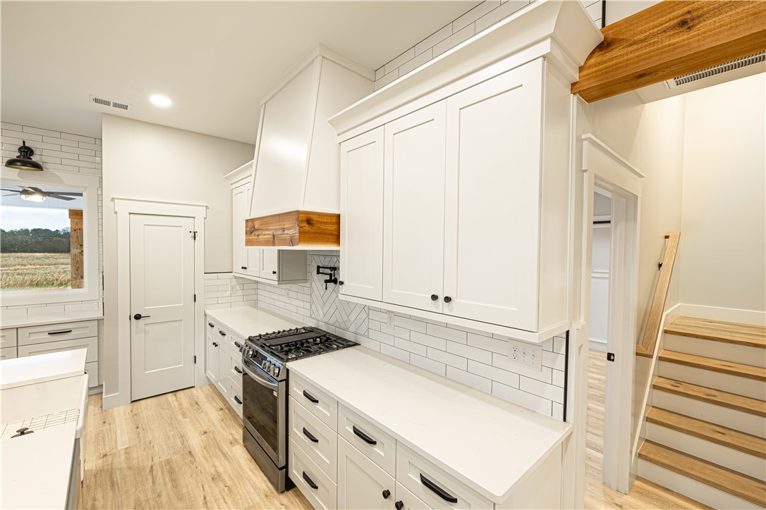 110 Hart Road Anderson, SC 29621 - Photo 31 of 31 This modern kitchen features crisp white cabinetry, durable flooring, and ample counter space.