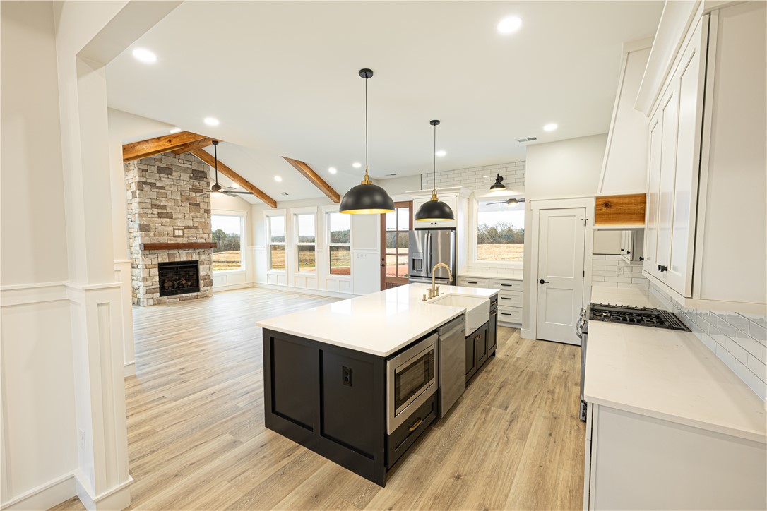 110 Hart Road Anderson, SC 29621 - Photo 4 of 31 This spacious interior seamlessly blends a modern kitchen with a cozy living area.