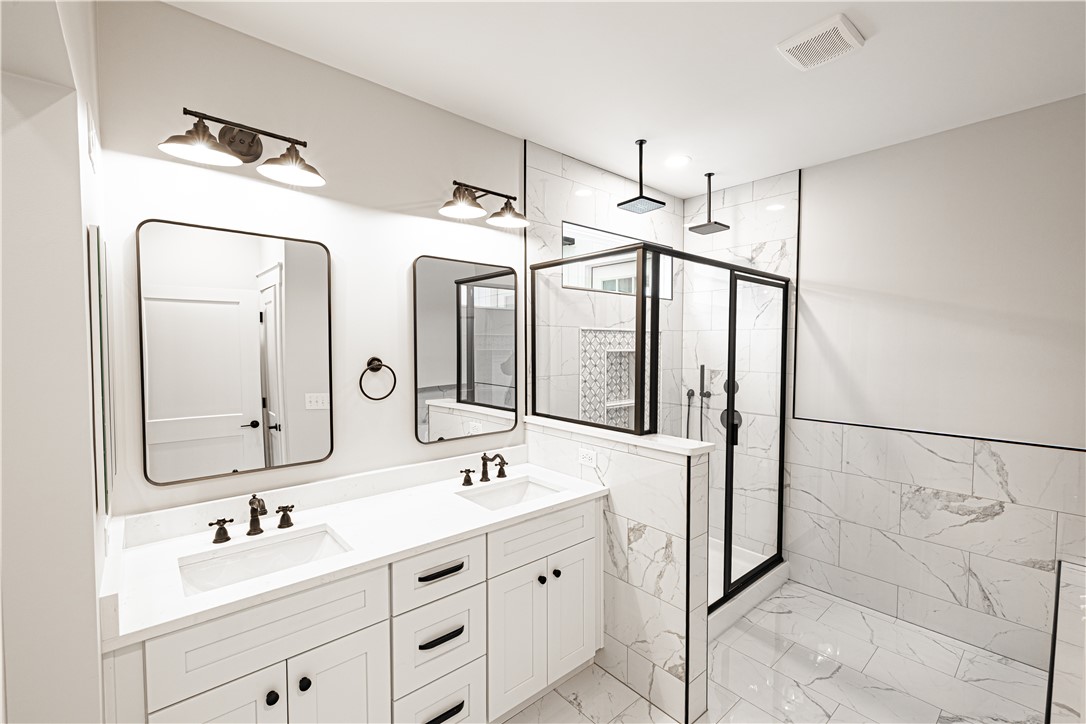 110 Hart Road Anderson, SC 29621 - Photo 5 of 31 This newly renovated bathroom features a spacious shower and dual vanities, offering comfort and style.