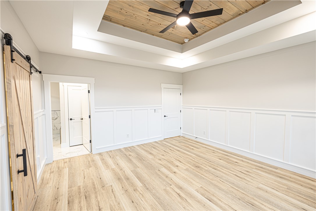 110 Hart Road Anderson, SC 29621 - Photo 8 of 31 This spacious room features detailed wainscoting and a beautiful wood planked tray ceiling.
